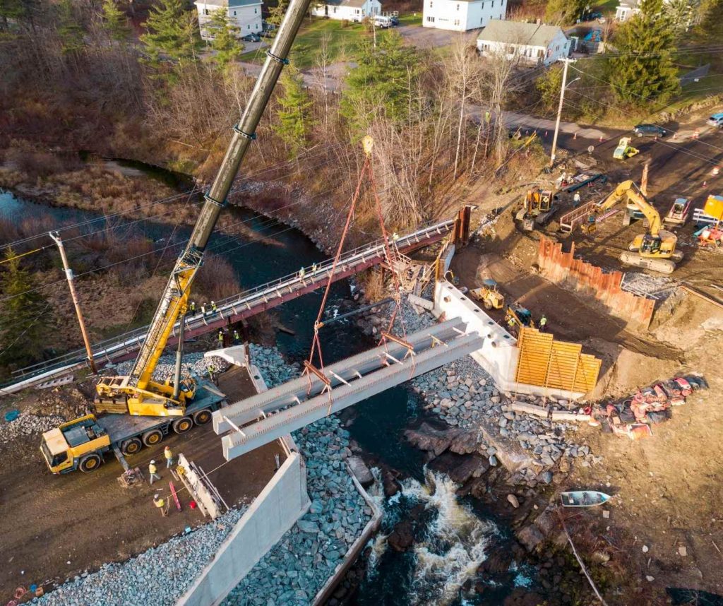 image of girders being placed by a crane at the Grist Mill Bridge location