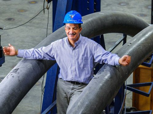 TIDC Director Dr. Habib Dagher with bridge in a backpack arches