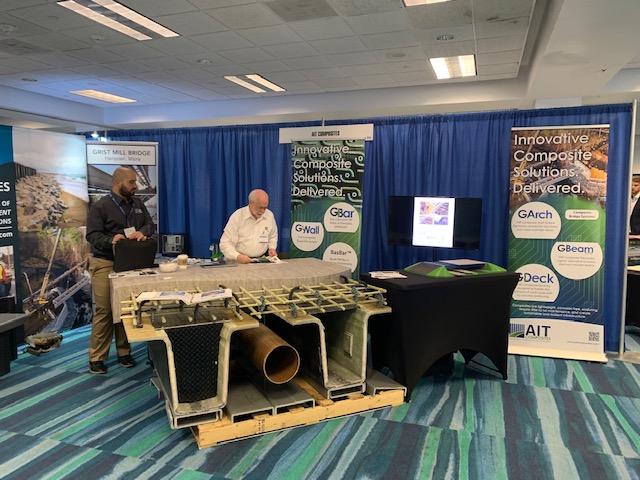 AIT Composites Booth with bridge girder model display at the 2022 Accelerated Bridge Construction Conference